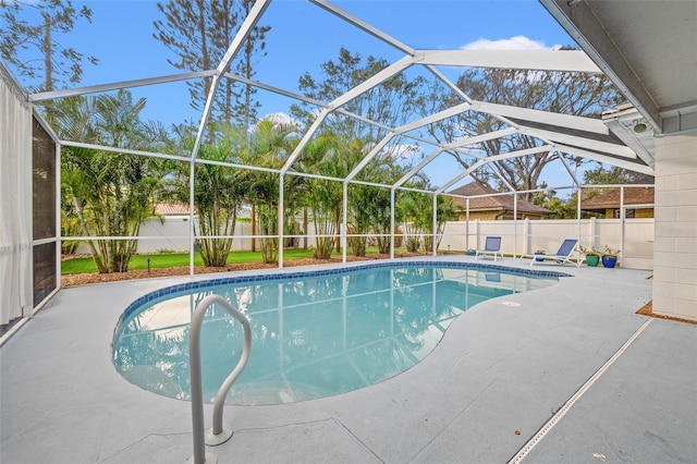 view of swimming pool featuring a fenced in pool, a lanai, a fenced backyard, and a patio