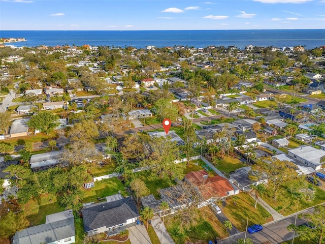 drone / aerial view featuring a residential view and a water view