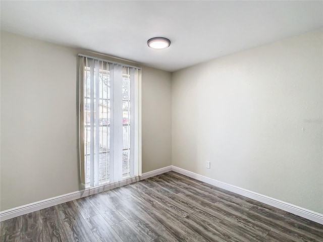 spare room featuring dark hardwood / wood-style floors