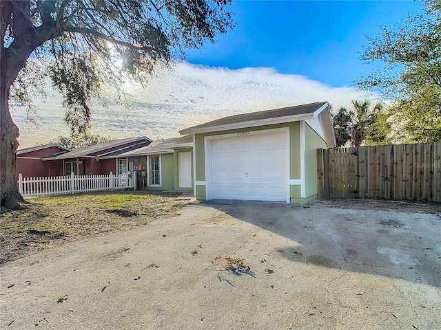 single story home with a garage