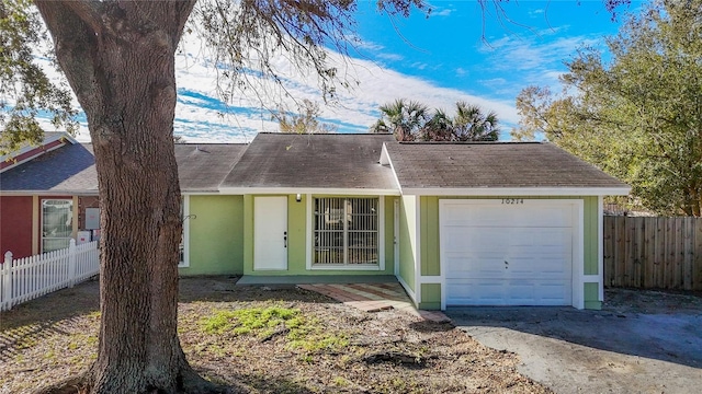 single story home featuring a garage