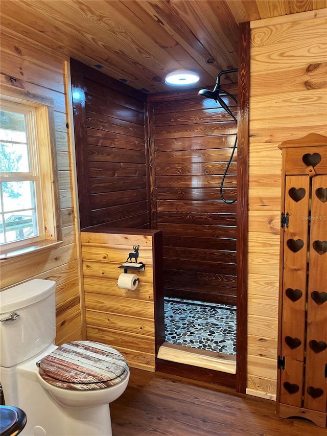 bathroom with wood ceiling, wood-type flooring, and wooden walls