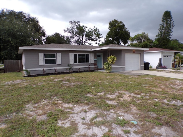 single story home featuring a garage and a front yard