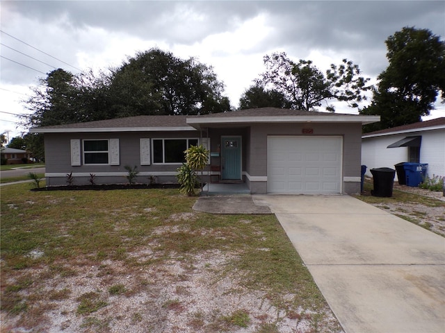 ranch-style house featuring a garage and a front yard