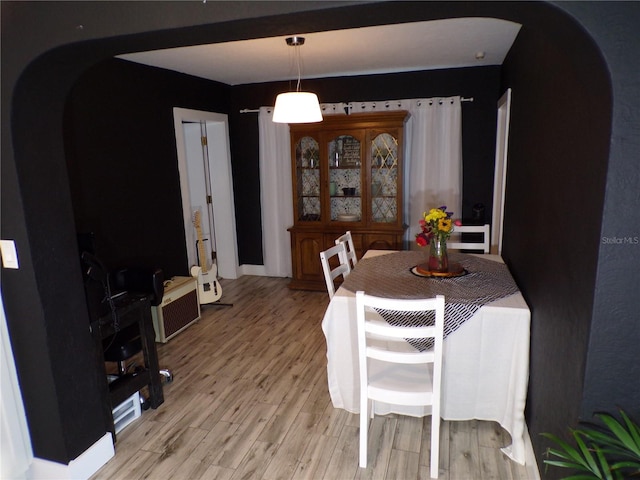 dining space featuring light wood-type flooring