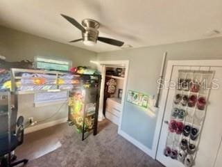 bedroom featuring ceiling fan and carpet flooring