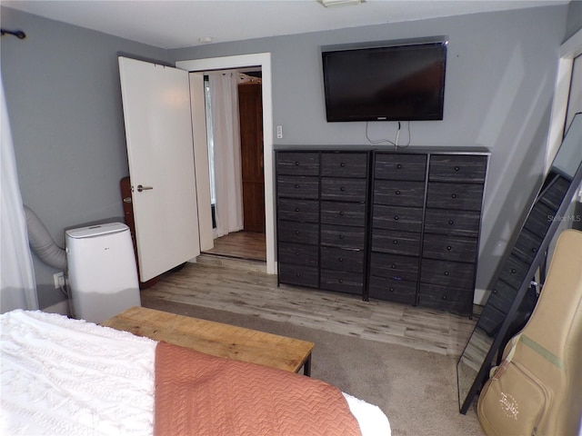 bedroom featuring hardwood / wood-style floors