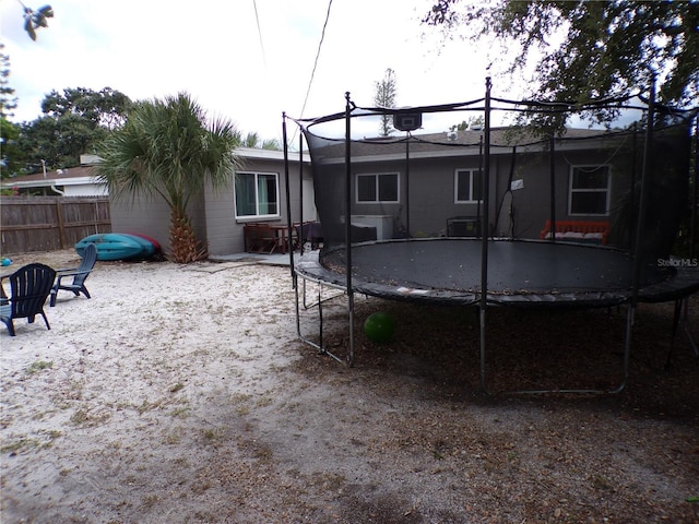 view of yard with a patio and a trampoline