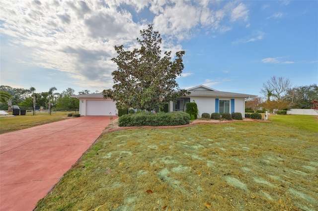 view of front facade with a garage and a front lawn