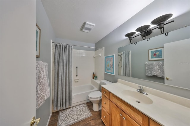 full bathroom featuring wood-type flooring, toilet, shower / tub combo, and vanity