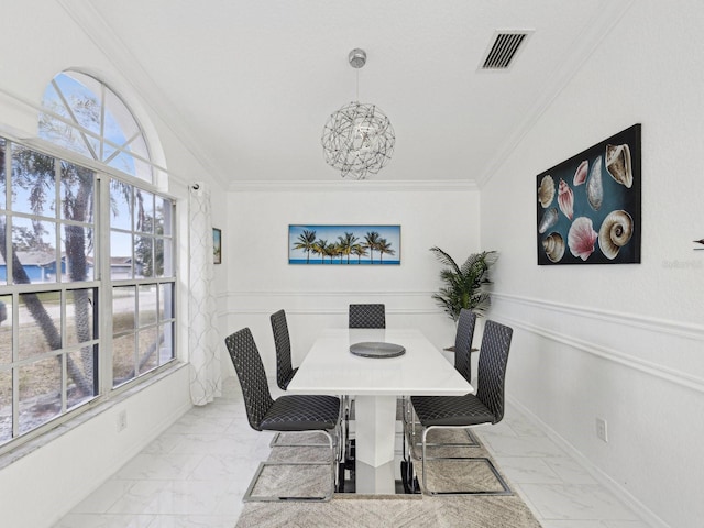 dining area featuring crown molding