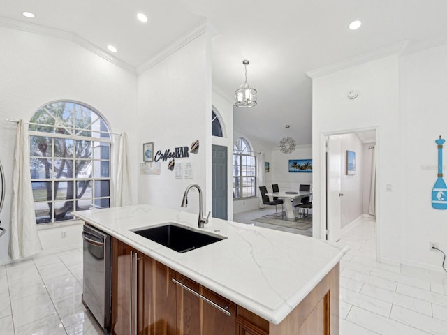 kitchen with sink, dishwasher, ornamental molding, an island with sink, and decorative light fixtures