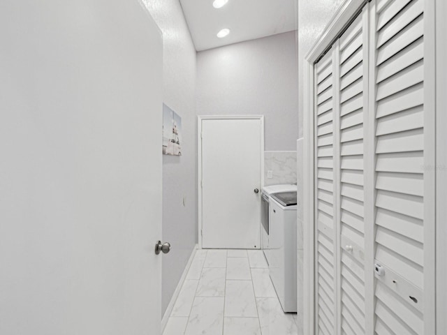 clothes washing area featuring independent washer and dryer