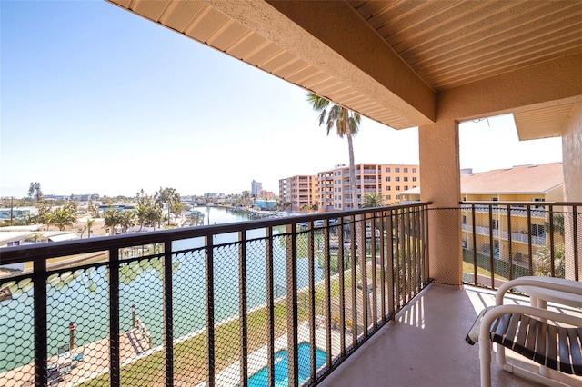 balcony featuring a water view