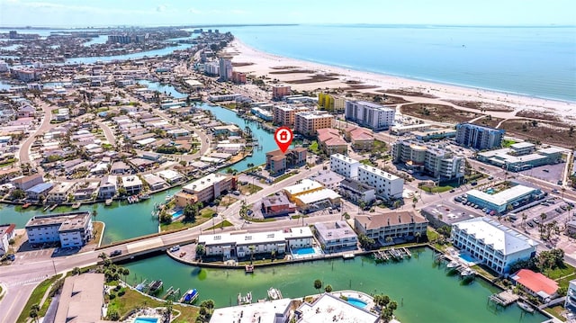 drone / aerial view featuring a water view and a beach view