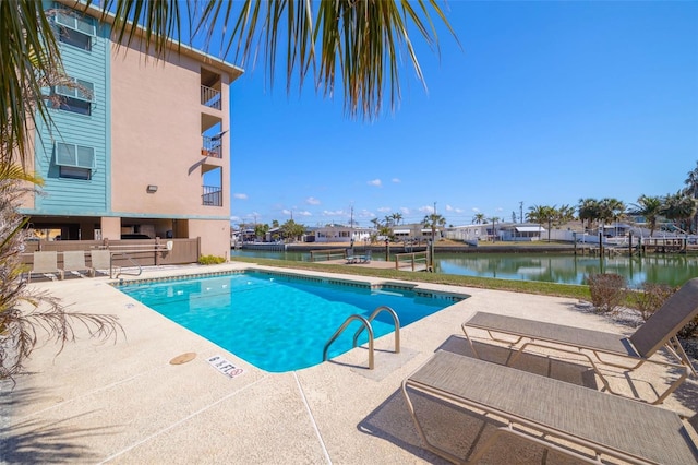 view of pool with a water view