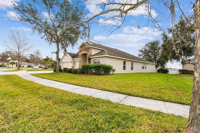 view of front of home featuring a garage and a front yard