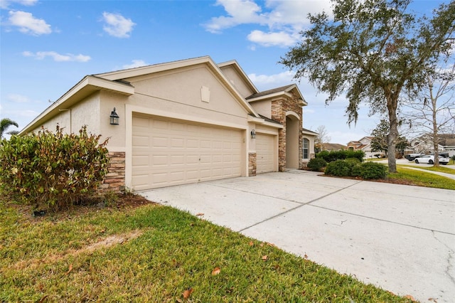 view of front of house with a garage and a front lawn