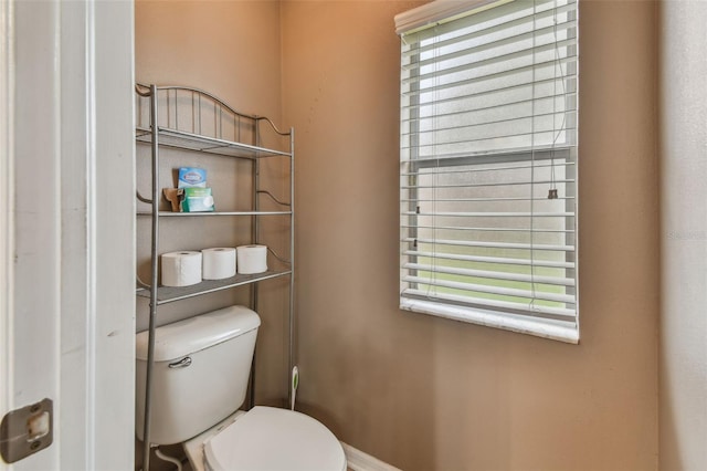 bathroom featuring toilet and a wealth of natural light