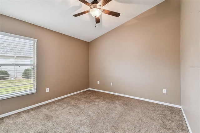 carpeted empty room with plenty of natural light and ceiling fan