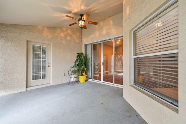 view of patio featuring ceiling fan