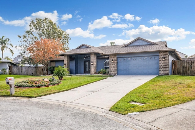 single story home with a garage and a front yard