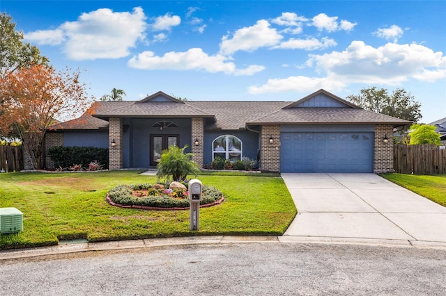 ranch-style home with french doors, a garage, and a front lawn