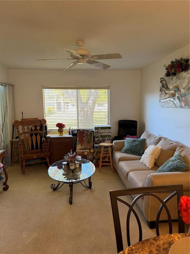 living room featuring ceiling fan and carpet flooring