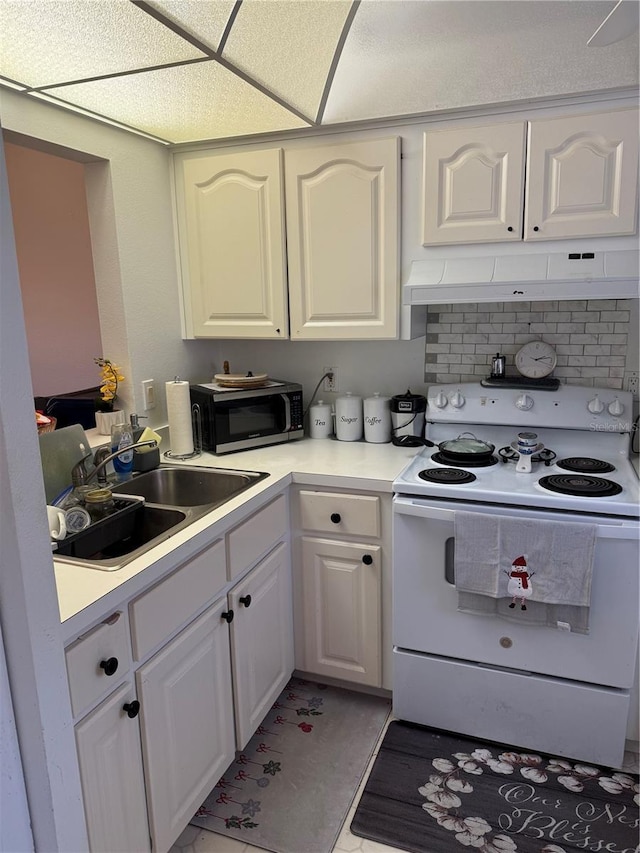 kitchen featuring a paneled ceiling, white cabinetry, sink, exhaust hood, and electric stove