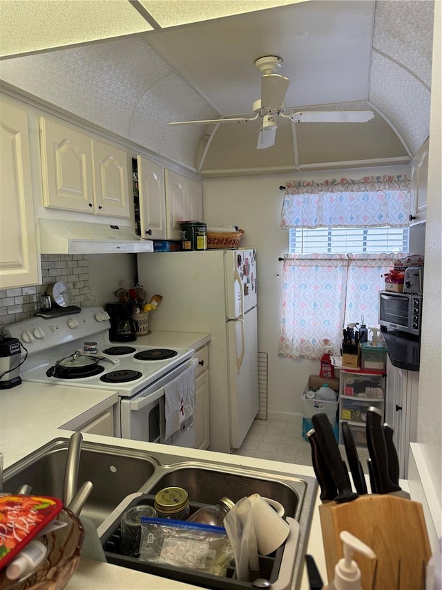 kitchen with white range with electric stovetop, white cabinetry, lofted ceiling, decorative backsplash, and ceiling fan