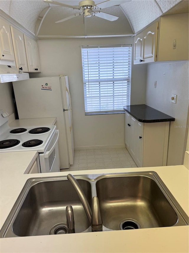 kitchen featuring under cabinet range hood, a sink, ceiling fan, white cabinets, and electric range