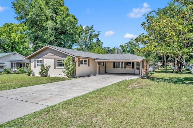 ranch-style house featuring a front yard and a carport