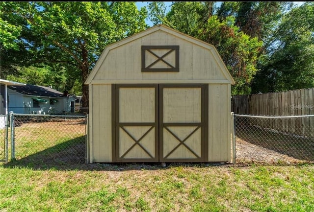 view of outbuilding with a yard