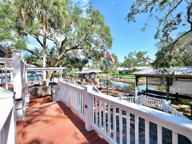 wooden deck with a water view