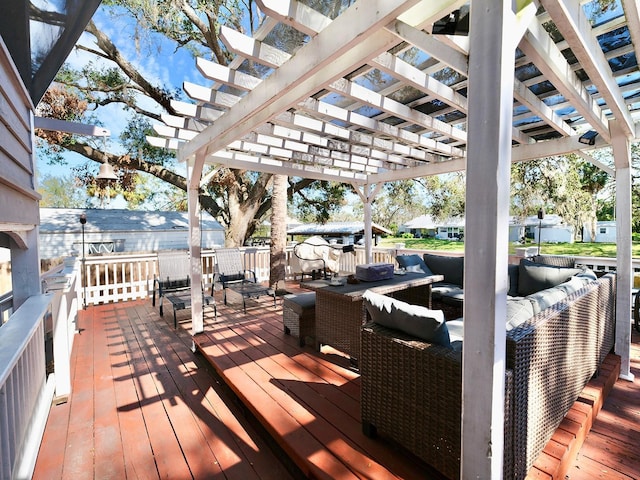 deck featuring outdoor lounge area and a pergola