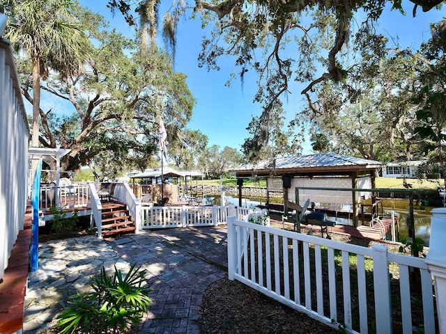 view of dock with a deck with water view