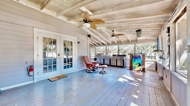 wooden deck featuring area for grilling, ceiling fan, and french doors