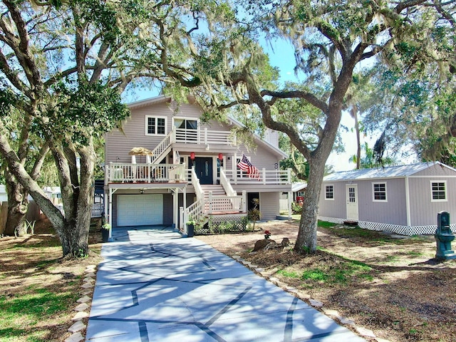 beach home featuring an outbuilding and a garage