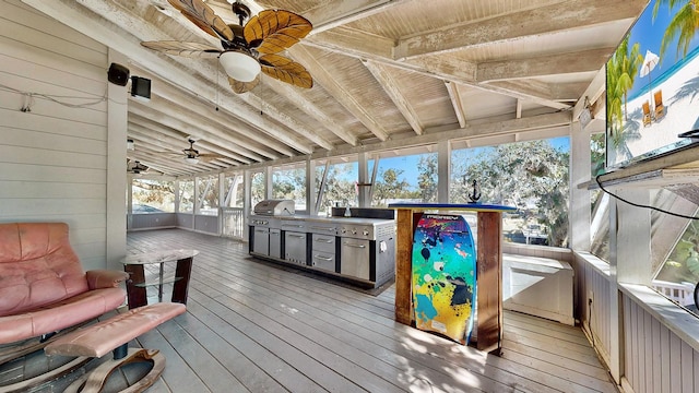 wooden deck featuring a grill, area for grilling, and ceiling fan