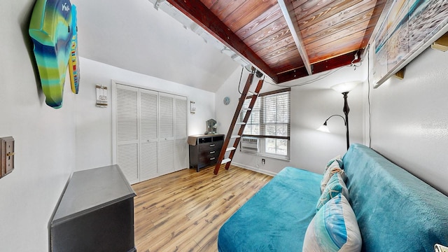 interior space featuring wood ceiling, lofted ceiling with beams, and light wood-type flooring