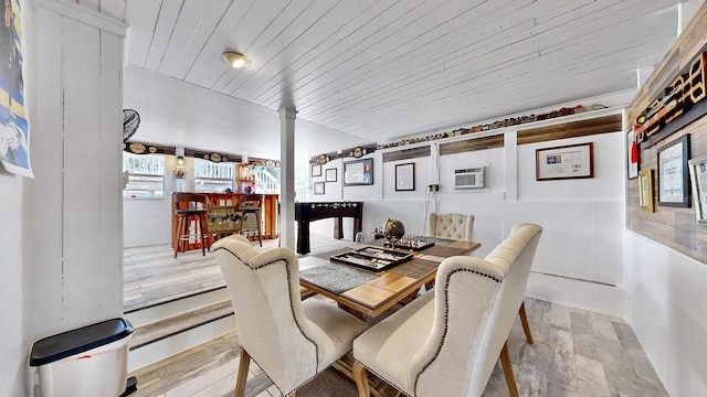 dining area with a wall mounted AC and wooden ceiling