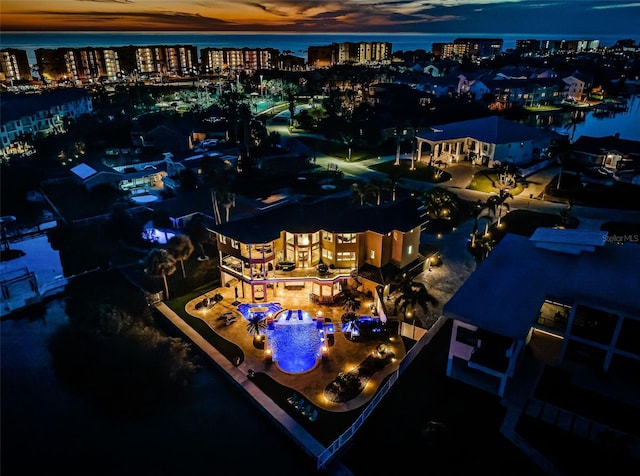 aerial view at dusk with a water view