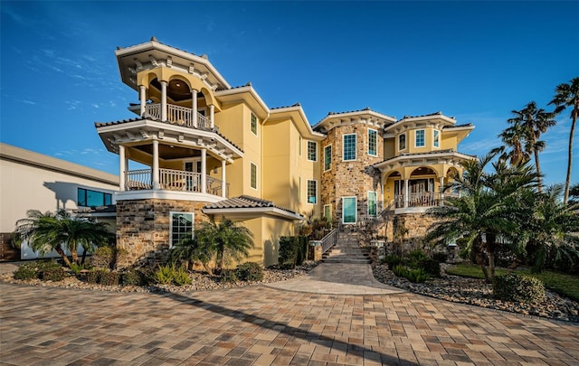 view of front of property with a balcony