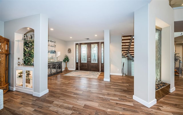 foyer entrance featuring wood-type flooring