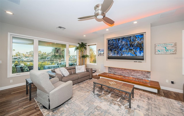 living room with hardwood / wood-style floors and ceiling fan