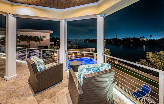 balcony at night with a water view