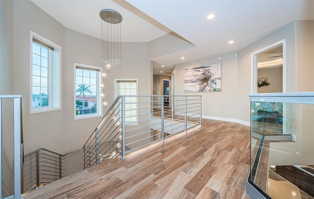 staircase with hardwood / wood-style flooring