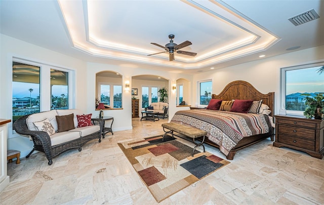 bedroom with a tray ceiling