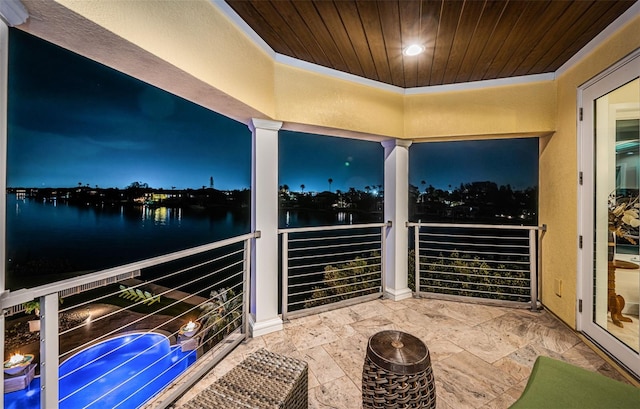 balcony featuring a water view