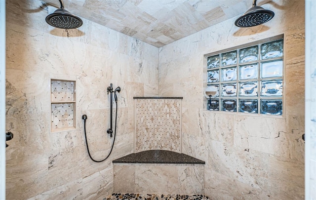 bathroom with tiled shower